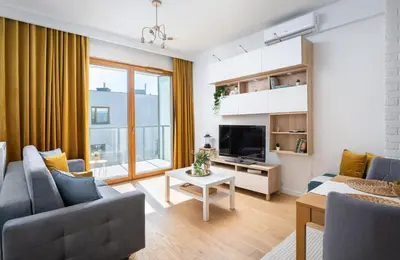 Telewizja i/lub zestaw kina domowego w obiekcie Białego Dębu Cosy Apartment by BookingHost