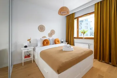 Łóżko lub łóżka w pokoju w obiekcie Białego Dębu Cosy Apartment by BookingHost