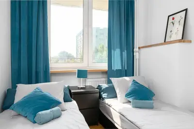 Łóżko lub łóżka w pokoju w obiekcie Warsaw Concierge Srebrna