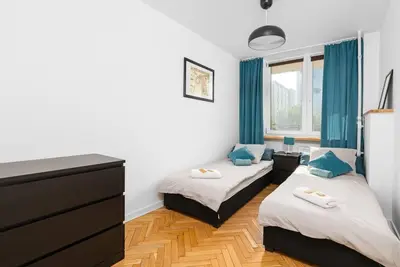 Łóżko lub łóżka w pokoju w obiekcie Warsaw Concierge Srebrna