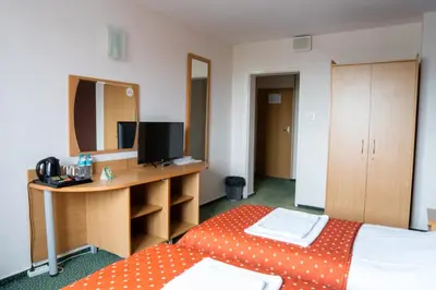 Łóżko lub łóżka w pokoju w obiekcie Hotel Wilanów