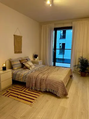 Łóżko lub łóżka w pokoju w obiekcie Apartament Centrum, miejsce parkingowe w cenie
