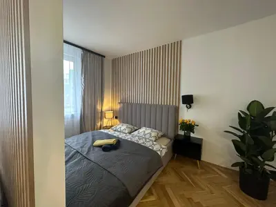Łóżko lub łóżka w pokoju w obiekcie MKI Apartments - Zlota 69 Warsaw City Center Apartment