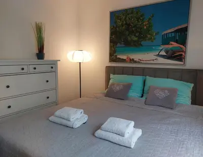 Łóżko lub łóżka w pokoju w obiekcie Apartament JK 47 A z miejscem postojowym w garażu
