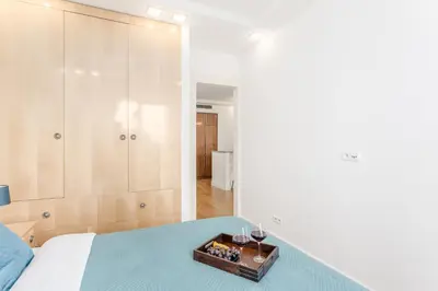 Łóżko lub łóżka w pokoju w obiekcie Warsaw City Apartments Browary