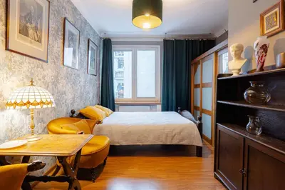 Łóżko lub łóżka w pokoju w obiekcie Art Apartament Chmielna 10