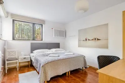 Łóżko lub łóżka w pokoju w obiekcie P&O Apartments Juhasów - Wawer