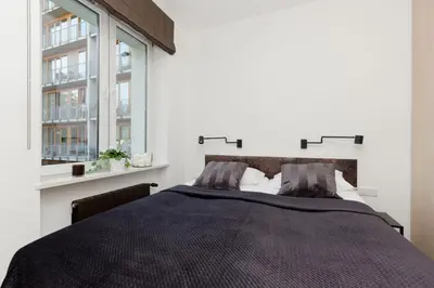 Łóżko lub łóżka w pokoju w obiekcie Warsaw Central Apartment 10 min walk from Palace of Culture & Science by Noclegi Renters