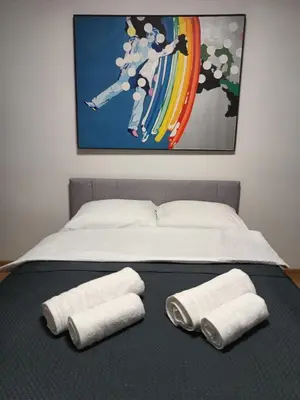 Łóżko lub łóżka w pokoju w obiekcie Nowogrodzka Central Apartment