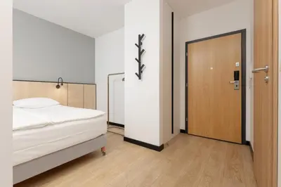 Łóżko lub łóżka w pokoju w obiekcie Comfy Studio Targowa next to PGE Narodowy by Noclegi Renters