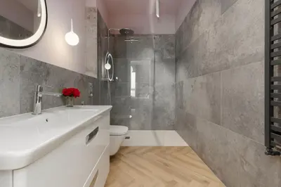 Łazienka w obiekcie Cozy & Spacious Family Apartment by Noclegi Renters