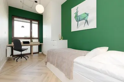 Łóżko lub łóżka w pokoju w obiekcie Cozy & Spacious Family Apartment by Noclegi Renters
