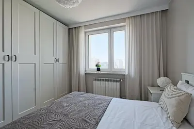 Łóżko lub łóżka w pokoju w obiekcie Metropolitan Heaven Apartment Emilii Plater 55