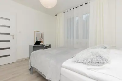 Łóżko lub łóżka w pokoju w obiekcie Kopcińskiego Bright & Spacious Apartment Warsaw Ursynów by Noclegi Renters