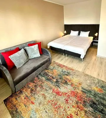 Łóżko lub łóżka w pokoju w obiekcie Ursynów Fine Apartment