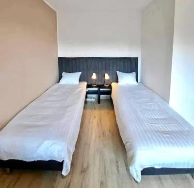 Łóżko lub łóżka w pokoju w obiekcie Ursynów Fine Apartment