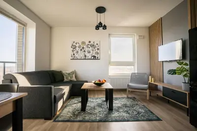Telewizja i/lub zestaw kina domowego w obiekcie Bizapartments - Modern Flats with Parking