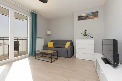 Część wypoczynkowa w obiekcie Beautiful & Quiet Studio Szeligowska by Noclegi Renters