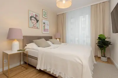 Łóżko lub łóżka w pokoju w obiekcie Warsaw Praga Apartment Podskarbińska by Noclegi Renters