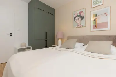 Łóżko lub łóżka w pokoju w obiekcie Warsaw Praga Apartment Podskarbińska by Noclegi Renters