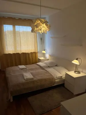 Łóżko lub łóżka w pokoju w obiekcie Murano Apartaments Business