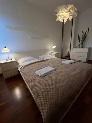 Łóżko lub łóżka w pokoju w obiekcie Murano Apartaments Business