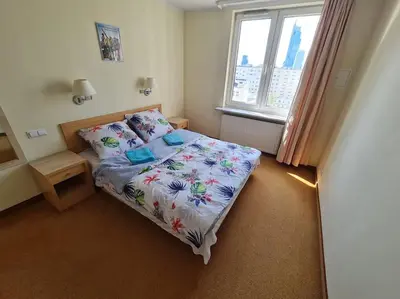 Łóżko lub łóżka w pokoju w obiekcie 10Q - Z6 Apartment 1003