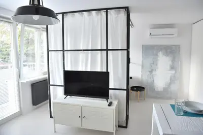 Telewizja i/lub zestaw kina domowego w obiekcie Apartment Warsaw Center Mokotowska