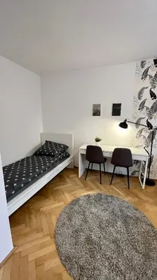 Łóżko lub łóżka w pokoju w obiekcie Warszawa Krucza Pokoje