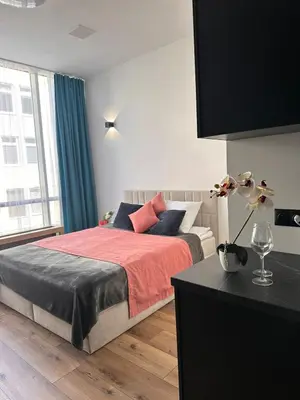 Łóżko lub łóżka w pokoju w obiekcie Hotel Apart