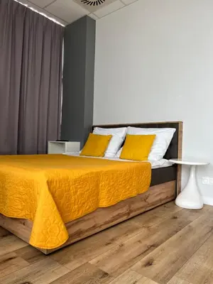 Łóżko lub łóżka w pokoju w obiekcie Hotel Apart