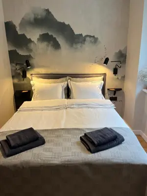 Łóżko lub łóżka w pokoju w obiekcie Luna Apartment