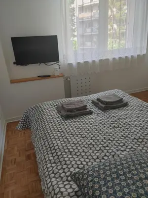 Łóżko lub łóżka w pokoju w obiekcie Ator Apartament