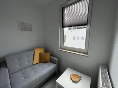 Część wypoczynkowa w obiekcie Studio Apartment Honey by Galeria Północna