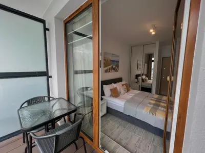 Łóżko lub łóżka w pokoju w obiekcie Studio Apartment Honey by Galeria Północna