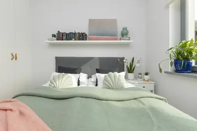 Łóżko lub łóżka w pokoju w obiekcie Cozy Apartment Gieysztora Wilanów by Noclegi Renters