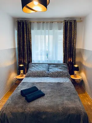 Łóżko lub łóżka w pokoju w obiekcie ClickTheFlat Solidarności City Center Apart Rooms