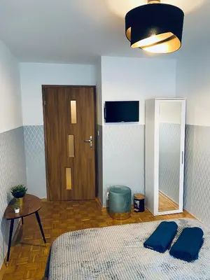 Łóżko lub łóżka w pokoju w obiekcie ClickTheFlat Solidarności City Center Apart Rooms