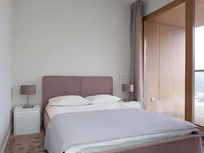Łóżko lub łóżka w pokoju w obiekcie Chopin Apartments - City