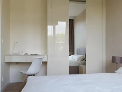 Łóżko lub łóżka w pokoju w obiekcie Chopin Apartments - City