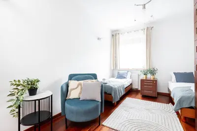 Łóżko lub łóżka w pokoju w obiekcie Royal Retreat Luxury Apartment Lazienki Park