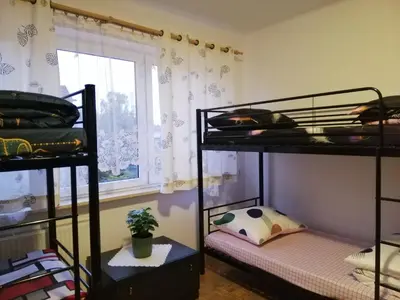 Łóżko lub łóżka w pokoju w obiekcie Ewa Dom