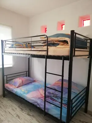 Łóżko lub łóżka w pokoju w obiekcie Ewa Dom