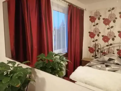 Łóżko lub łóżka w pokoju w obiekcie Ewa Dom