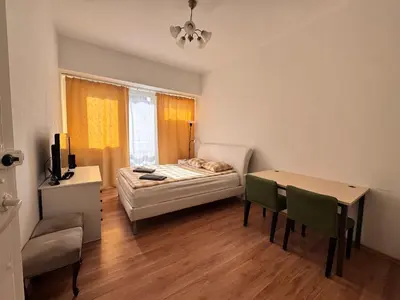 Łóżko lub łóżka w pokoju w obiekcie IVORY HOUSE ( CENTRUM )