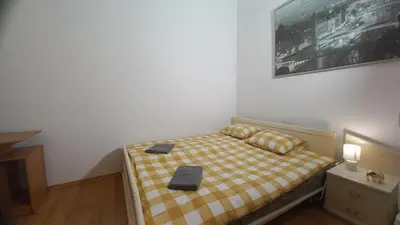 Łóżko lub łóżka w pokoju w obiekcie IVORY HOUSE ( CENTRUM )