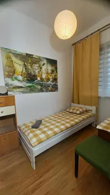 Łóżko lub łóżka w pokoju w obiekcie IVORY HOUSE ( CENTRUM )