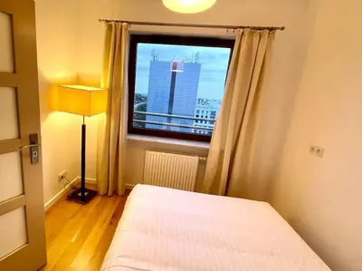 Łóżko lub łóżka w pokoju w obiekcie Concept Mokotów Prime Apartment
