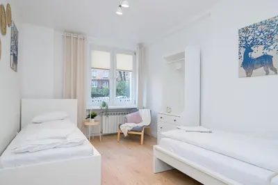 Łóżko lub łóżka w pokoju w obiekcie ShortStayPoland Dąbrowszczaków (B138)