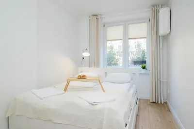 Łóżko lub łóżka w pokoju w obiekcie ShortStayPoland Dąbrowszczaków (B138)